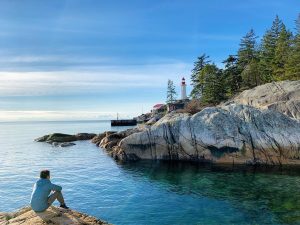 Man looking at lighthouse